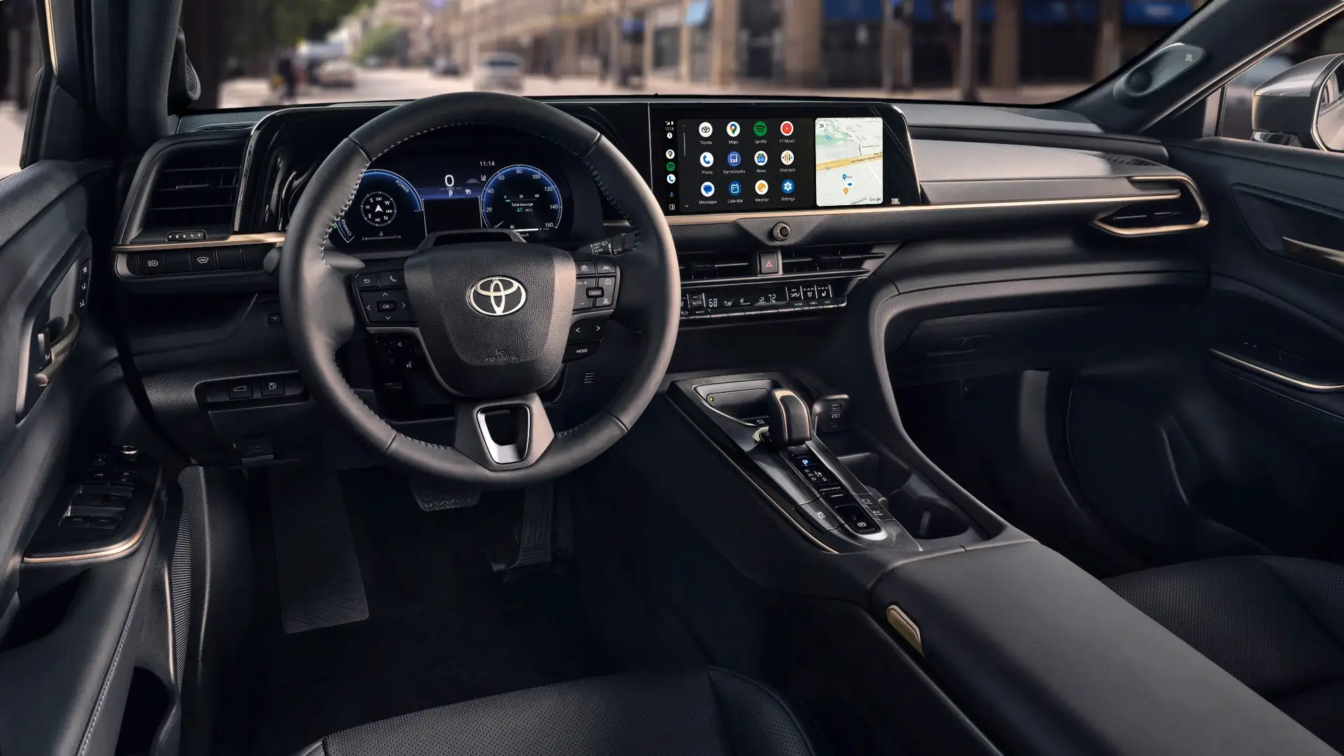 Interior view of the 2026 Toyota Crown showing spacious front seating, premium materials, and generous passenger legroom.