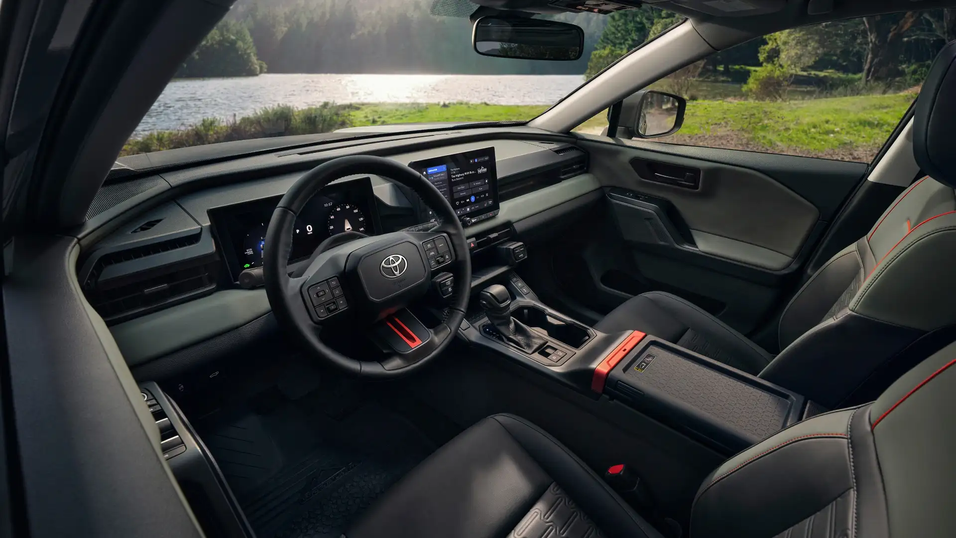 2026 Toyota RAV4 interior view featuring driver-focused cockpit, large touchscreen display, and intuitive technology interface.