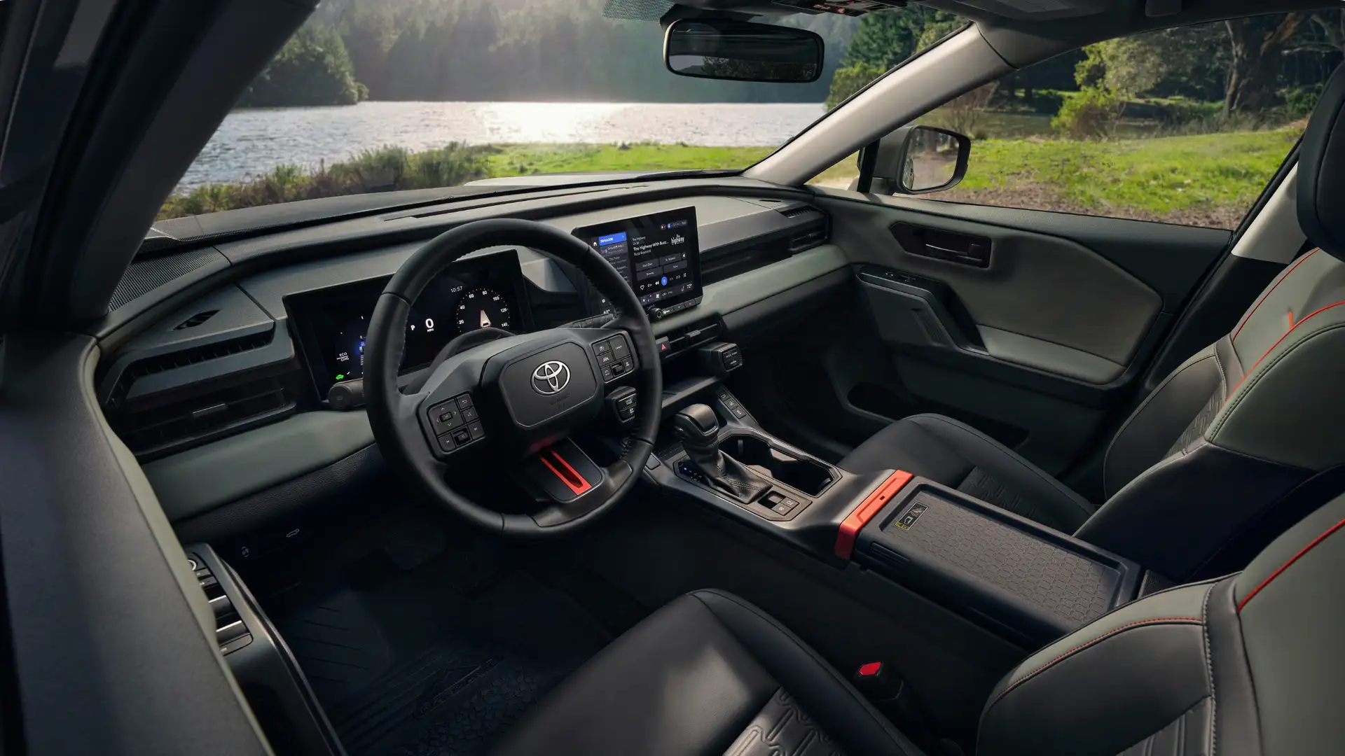 Interior of the 2026 Toyota RAV4 displaying driver cockpit, touchscreen infotainment system, and practical center console layout.