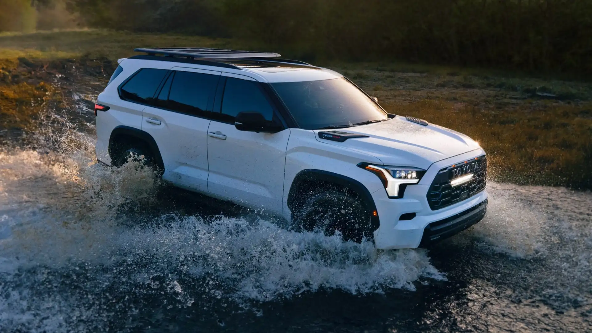 2025 Toyota Sequoia driving through shallow water on rugged terrain, demonstrating off-road performance for Maryland and Hagerstown adventures.