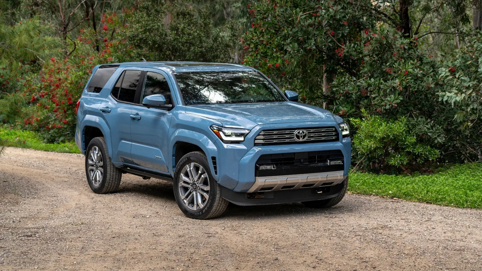 The 2024 Toyota 4Runner in Hagerstown, MD parked on a dirt road surrounded by trees, showcasing its durable SUV design and outdoor adventure ready build.