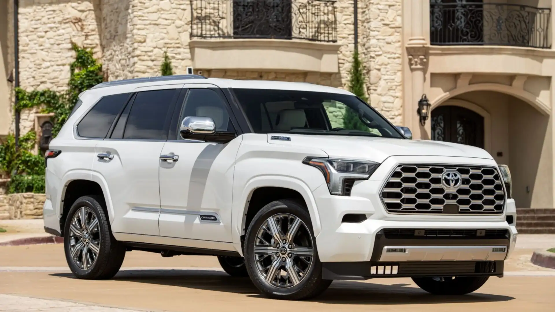 The 2025 Toyota Sequoia in Hagerstown, MD parked in front of a luxury home showcasing its full size SUV presence