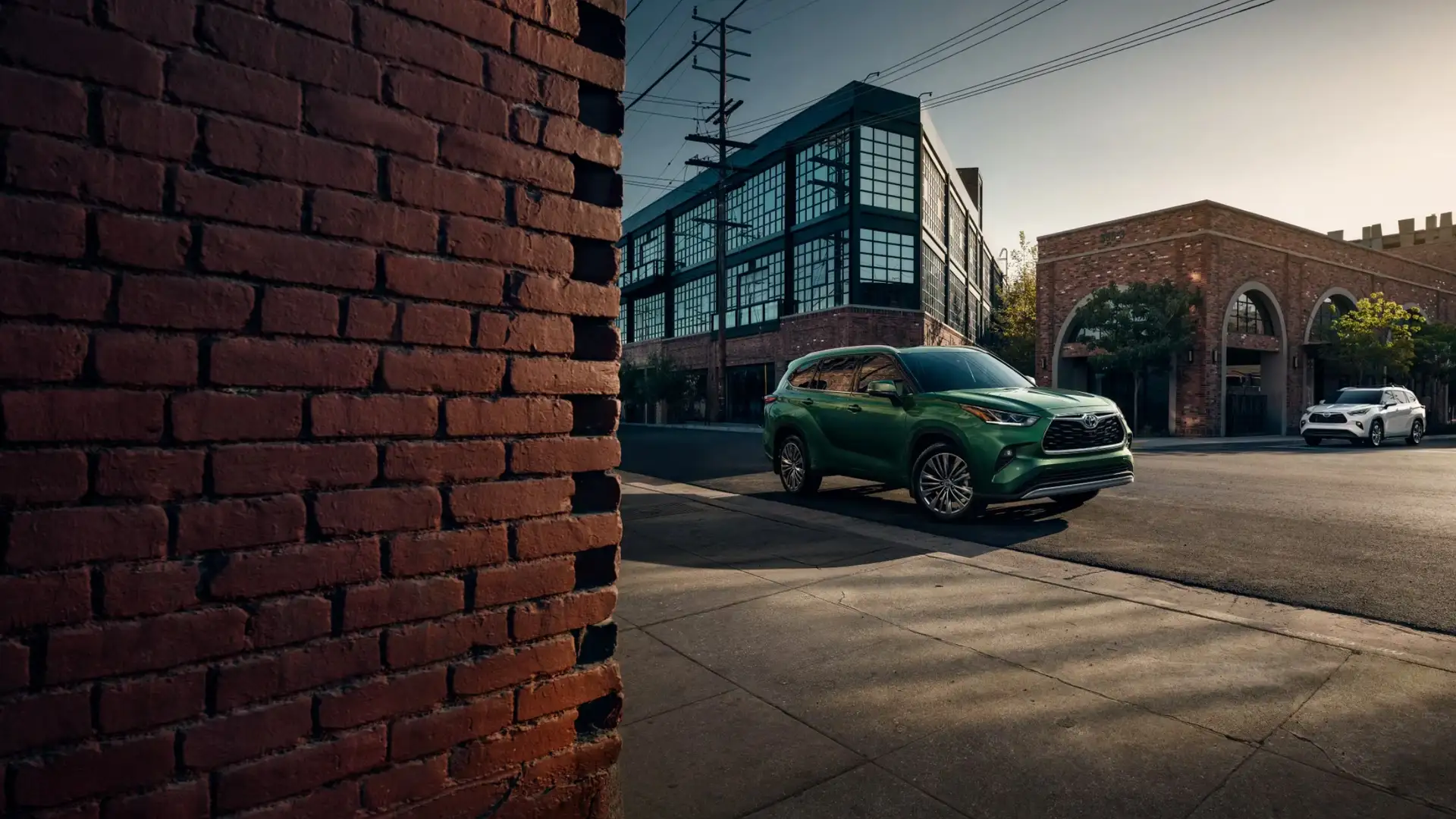 2025 Toyota Highlander customized with exterior accessories, shown in an urban setting to highlight popular upgrade options for Hagerstown drivers.