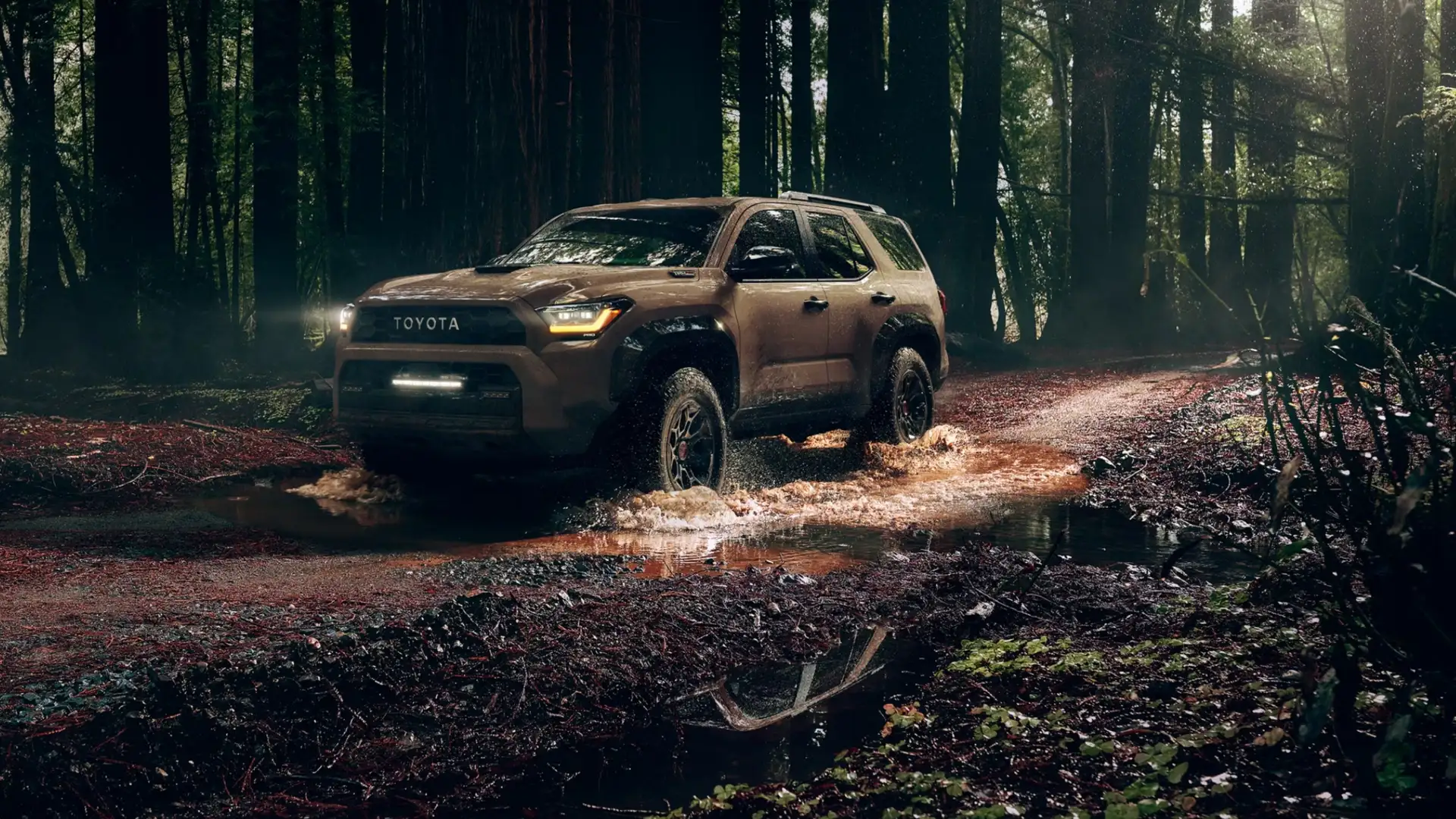 Two 2025 Toyota Tacoma trucks positioned on rocky terrain, highlighting towing strength and hauling capability for Hagerstown drivers.