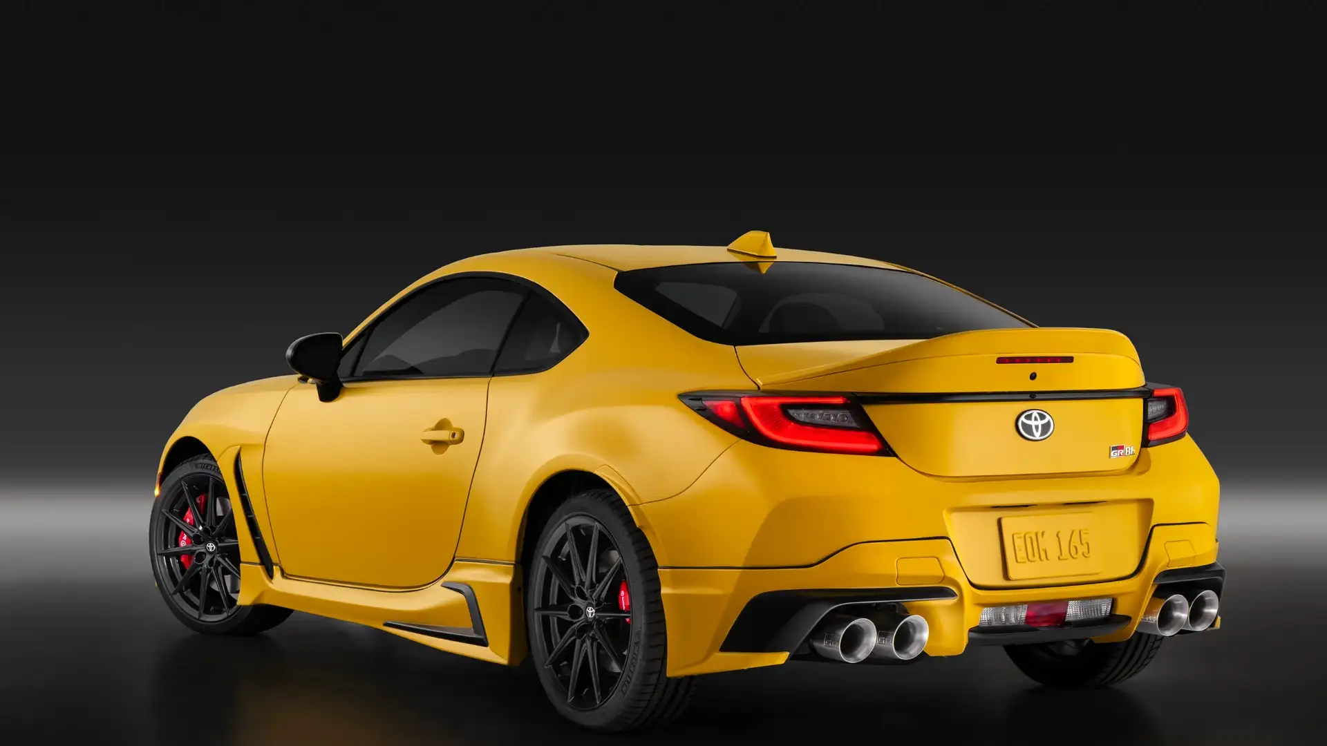 2026 Toyota GR86 sports coupe photographed from the rear, featuring a bold yellow exterior and performance styling for weekend drivers in Greencastle PA.