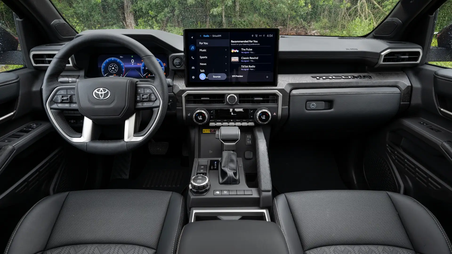 2026 Toyota Tacoma interior dashboard with infotainment screen, connectivity features, and power management controls