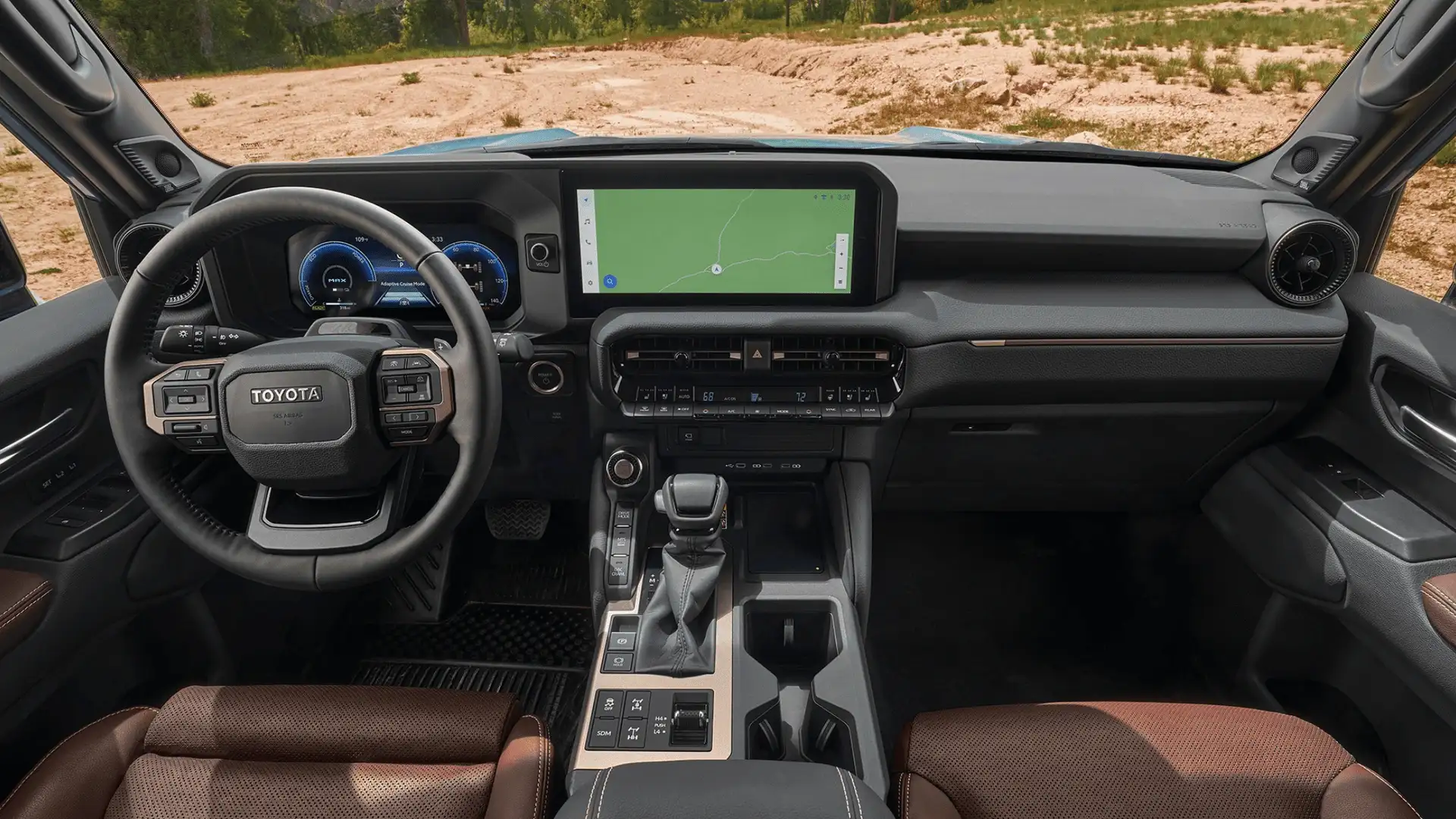 Interior of the 2026 Toyota Land Cruiser showing digital instrument cluster, wide infotainment display, and advanced driver interface controls.