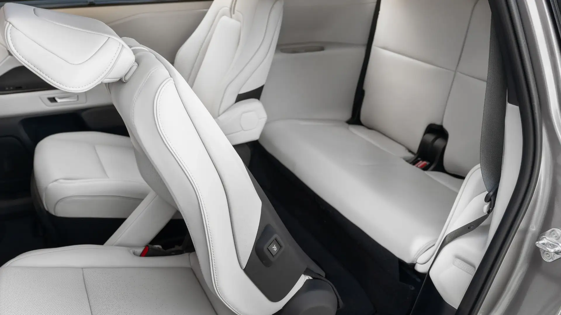 2026 Toyota Highlander third-row seating with white leather interior and folding second-row access in Hagerstown, MD.