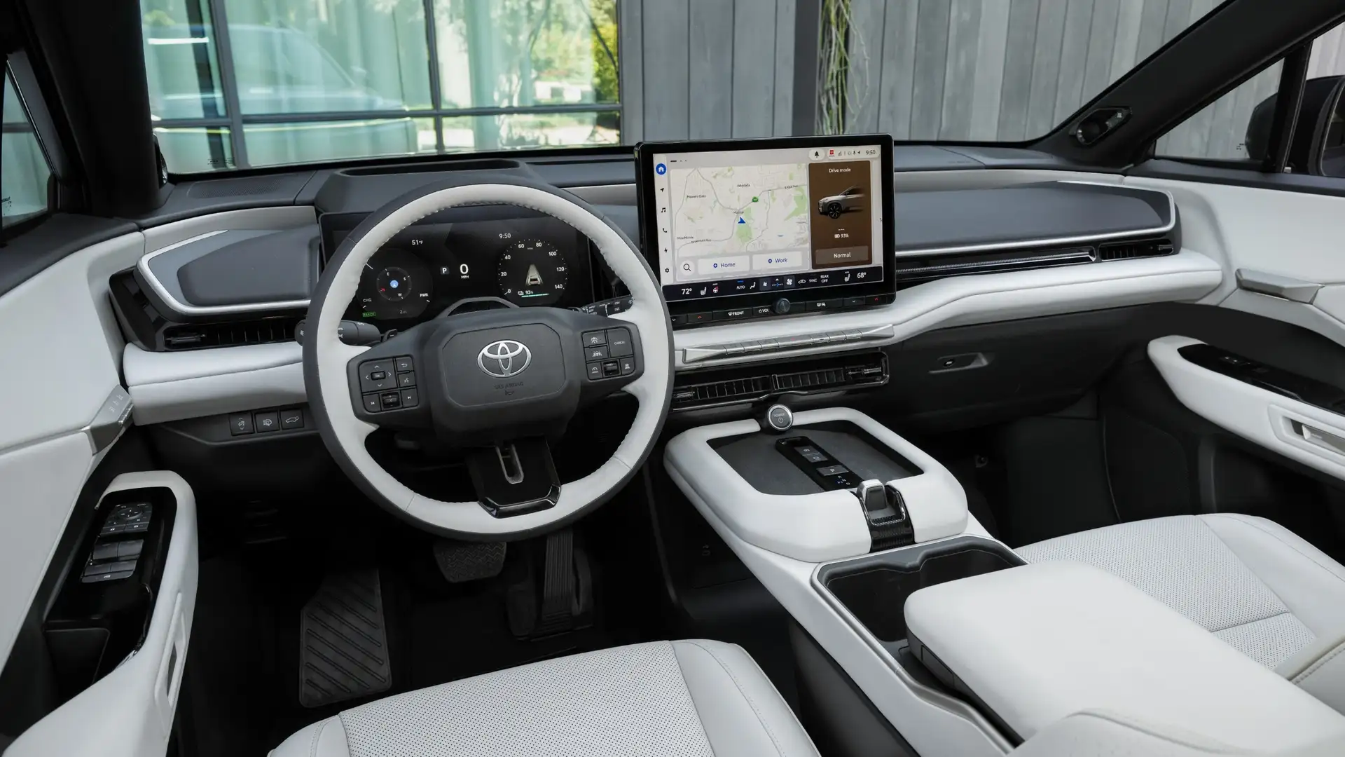 2026 Toyota Highlander dashboard with large touchscreen navigation display and white interior in Hagerstown, MD.