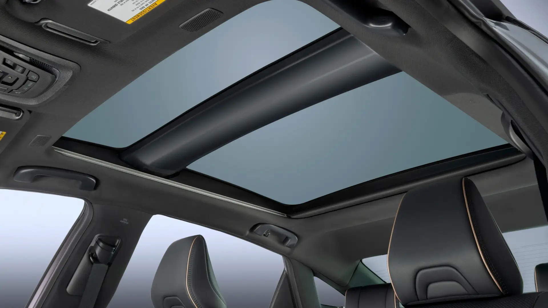 2026 Toyota Crown panoramic moonroof view from inside showing dual-pane glass roof with premium interior seating