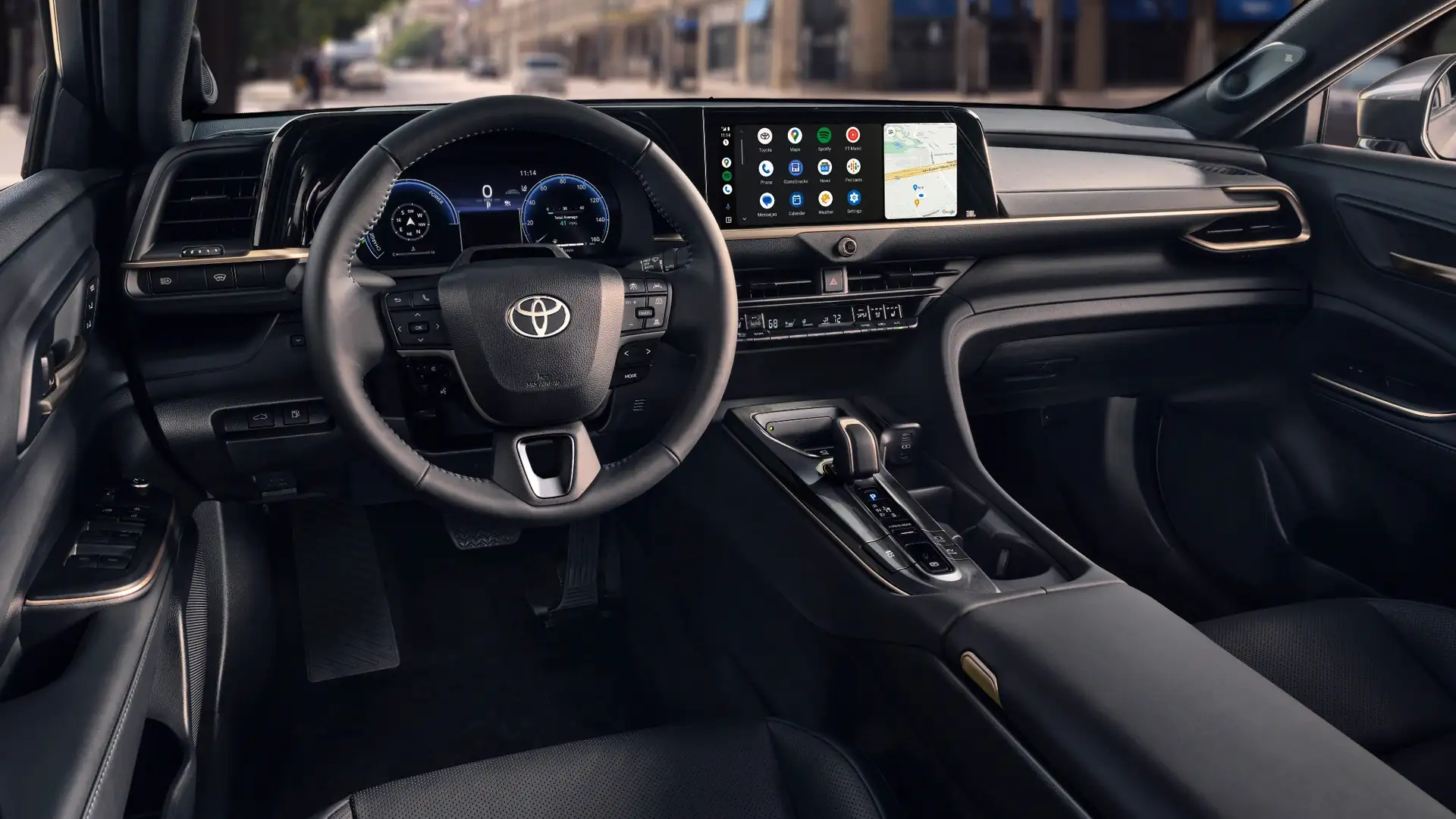 2026 Toyota Crown interior with widescreen infotainment display showing Android Auto, digital gauge cluster, and premium black cabin