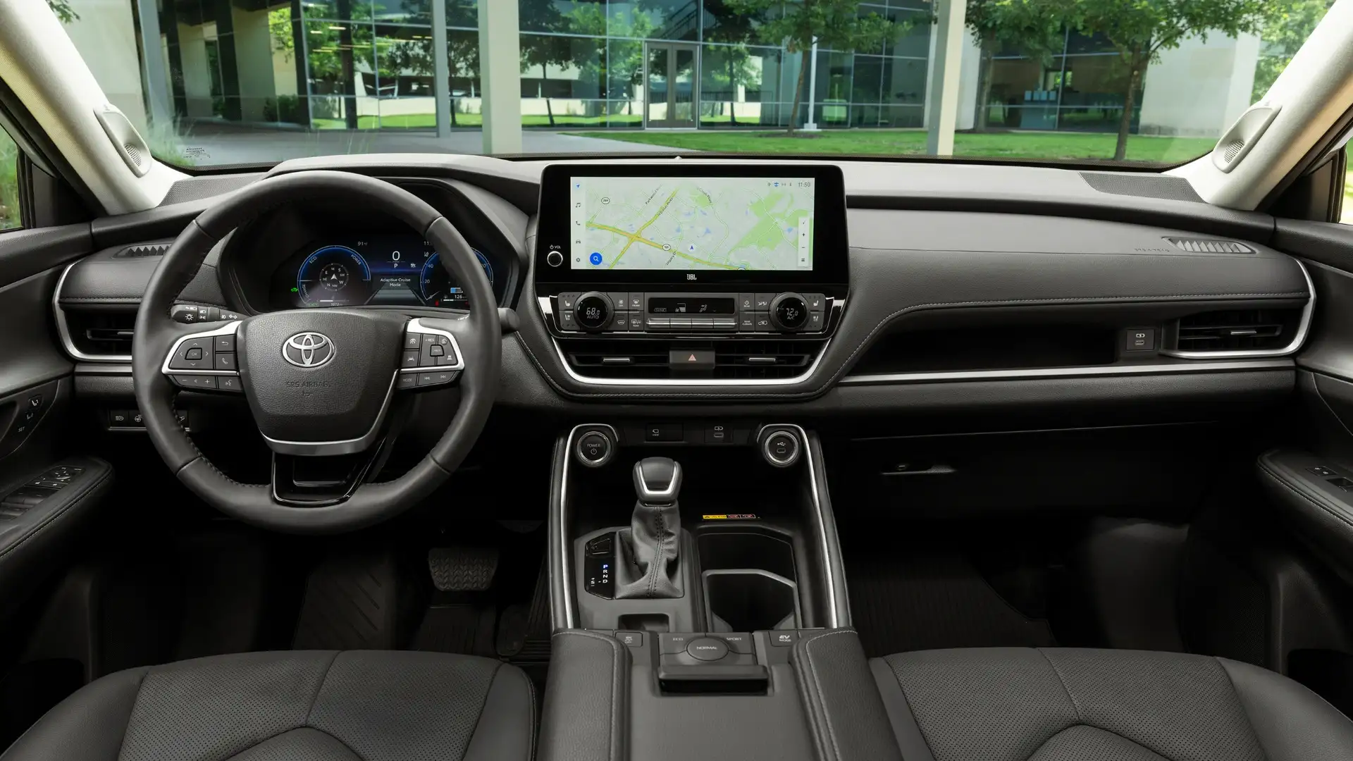 2026 Toyota Grand Highlander interior dashboard with large touchscreen navigation display, JBL audio system, and digital instrument cluster