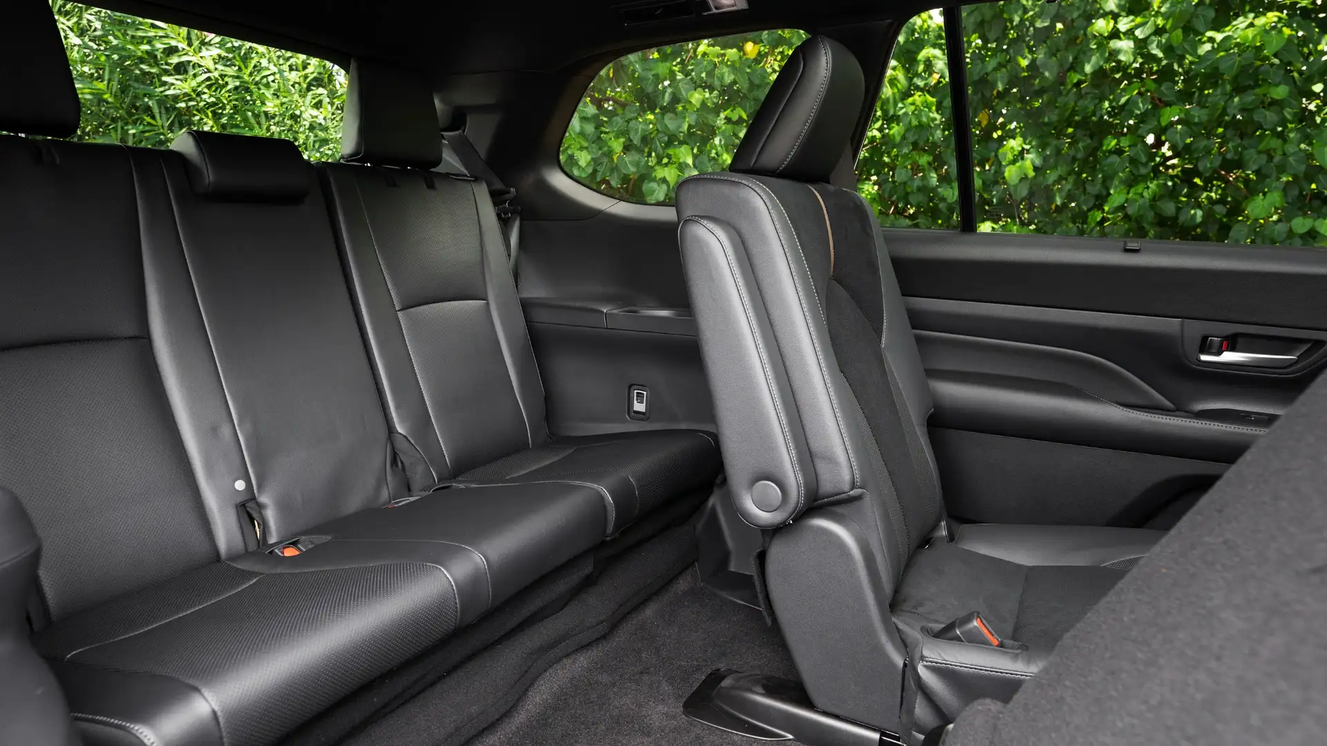 2026 Toyota Grand Highlander spacious third row seating with black leather upholstery and easy fold access for rear passengers