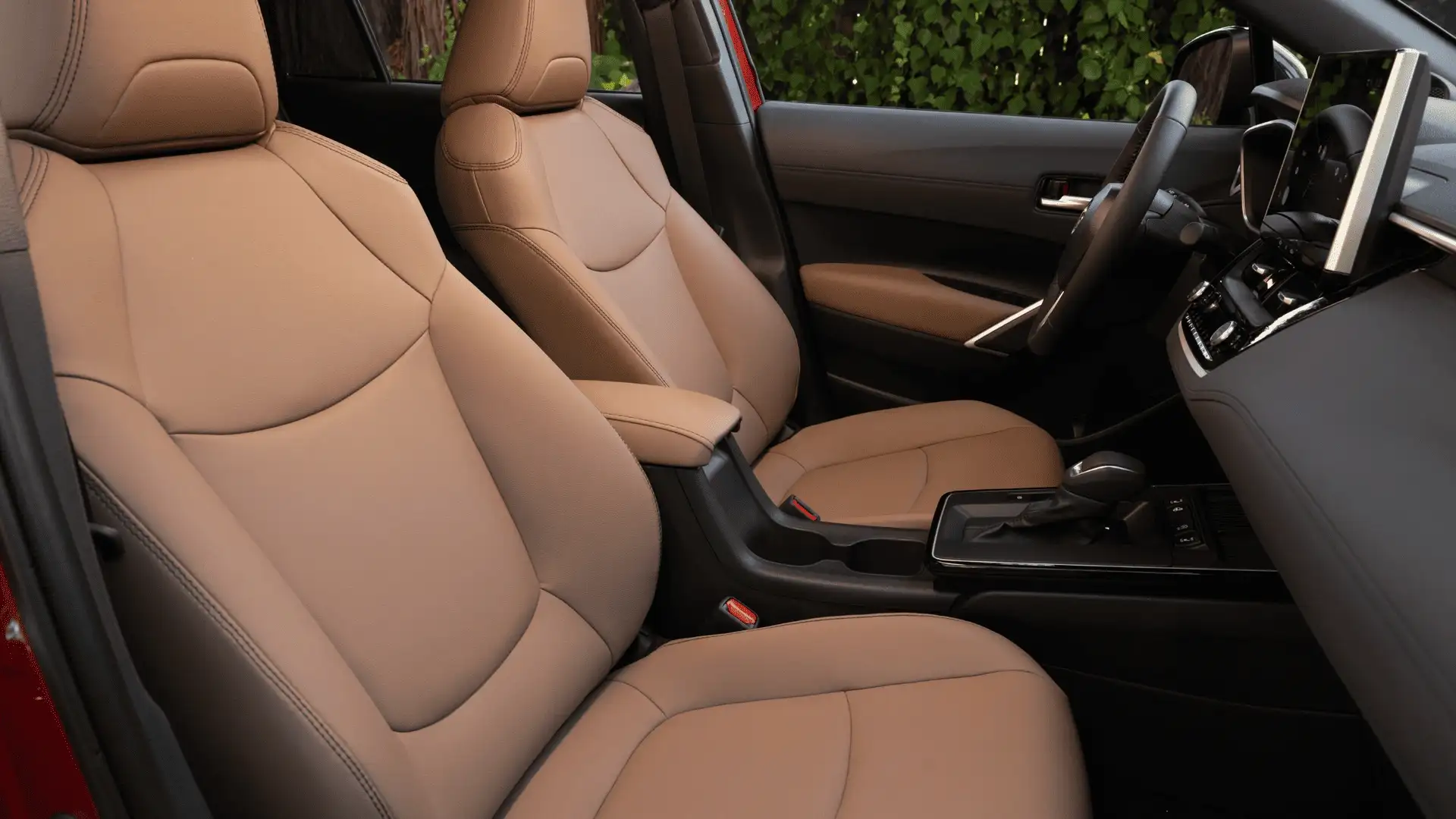 2026 Toyota Corolla Cross tan leather front seats and center console interior view