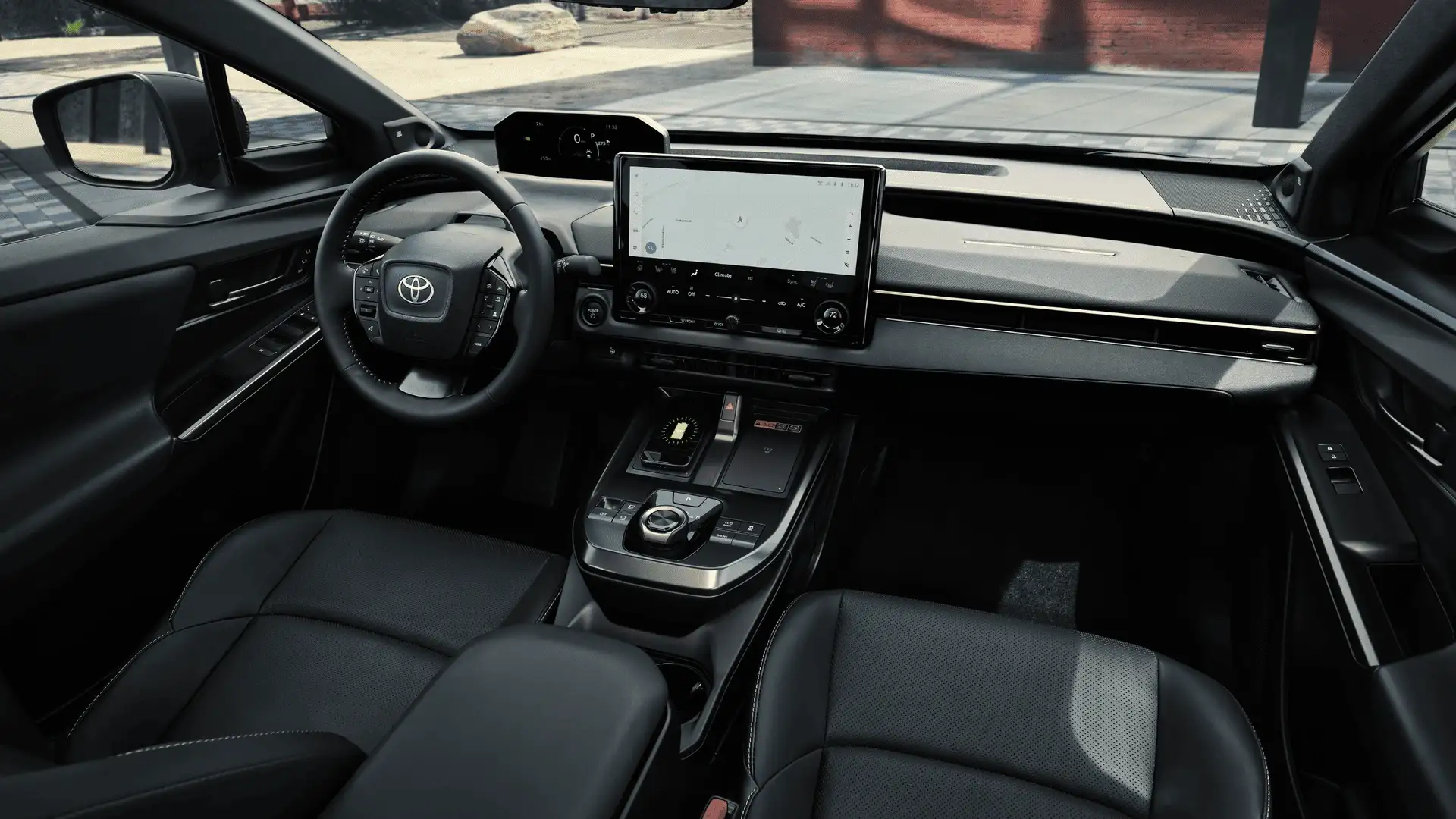 2026 Toyota bZ black leather interior dashboard and touchscreen navigation view