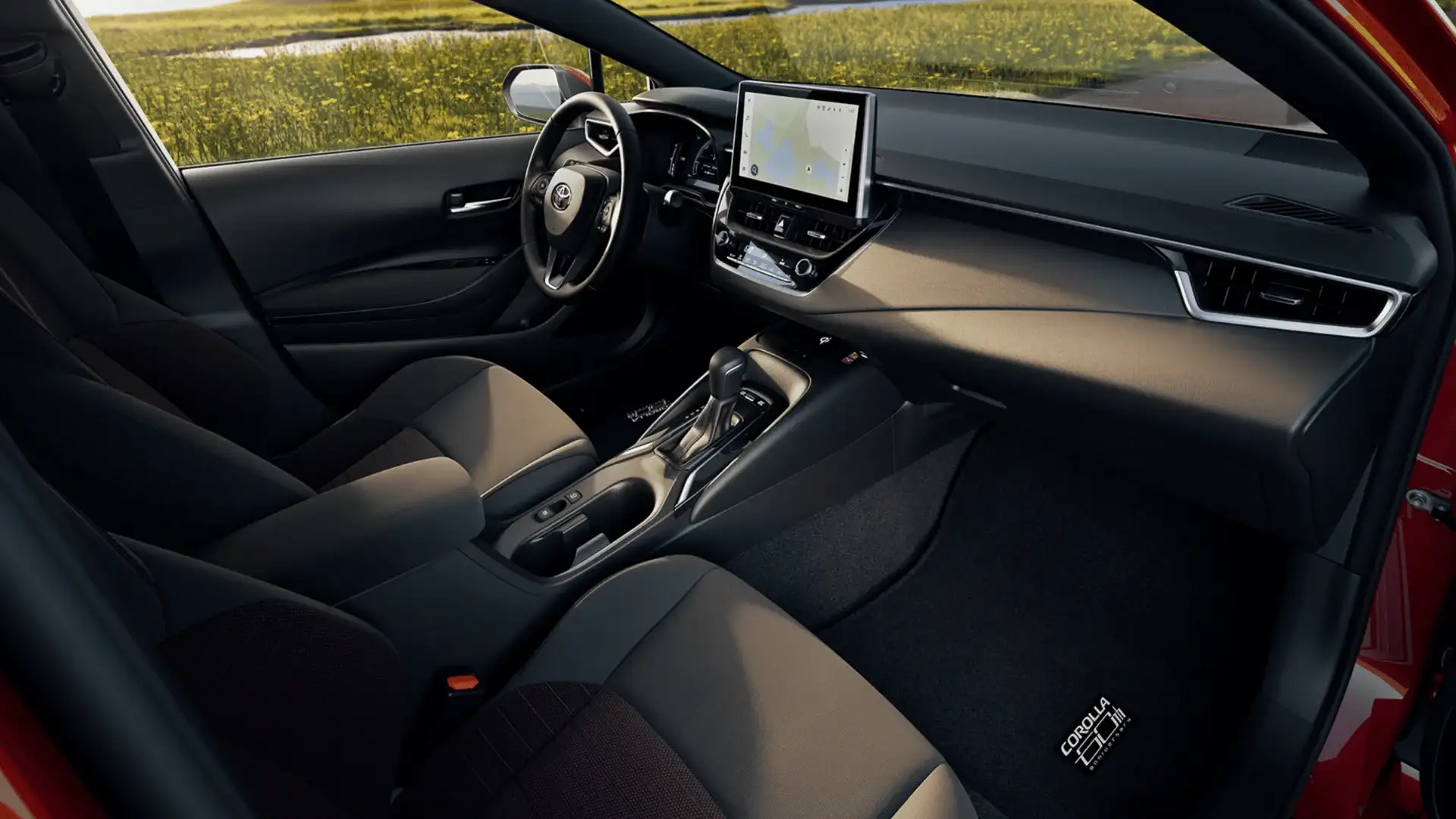 2027 Toyota Corolla interior with touchscreen display and gray cloth seats
