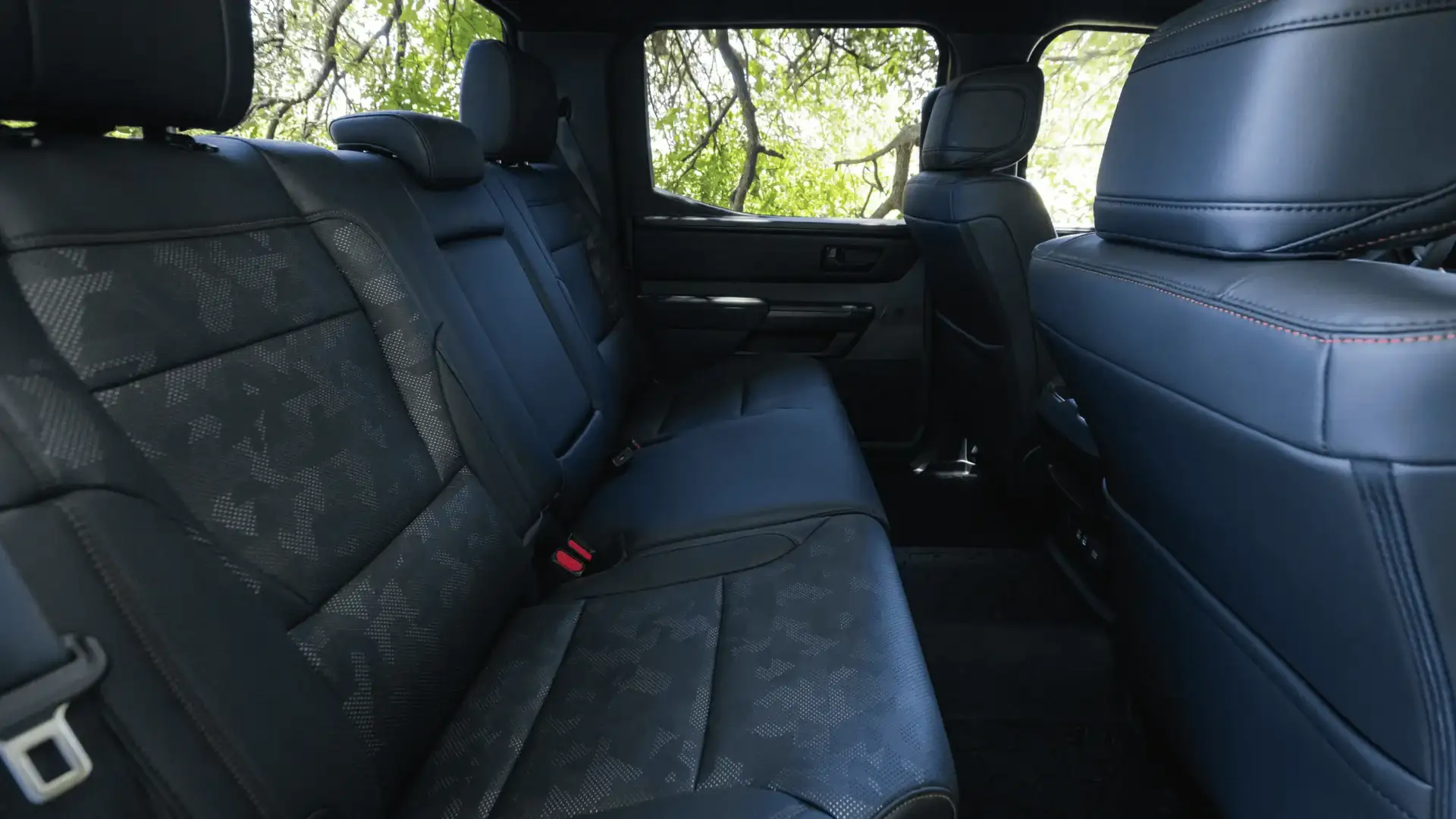 2027 Toyota Tundra crew cab rear seat with camo-pattern leather upholstery