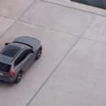 2025 Volvo XC60 SUV overhead rear view showcasing panoramic roof and modern exterior design
