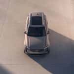 2025 Volvo XC90 Plug-In Hybrid top-down front view in architectural concrete setting