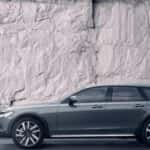 2025 Volvo V90 Cross Country luxury wagon side profile in dark gray outdoors