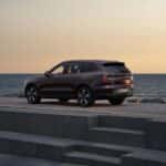 2025 Volvo EX90 electric SUV rear three quarter view with LED taillights and dark exterior finish