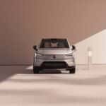 2025 Volvo EX90 electric SUV front view in silver shown charging with modern LED lighting design