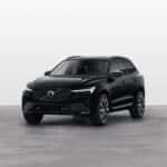 2025 Volvo XC60 luxury SUV in black displayed in three-quarter front view with bold grille
