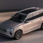 2026 Volvo XC90 Plug-In Hybrid elevated front three-quarter view in silver with panoramic roof